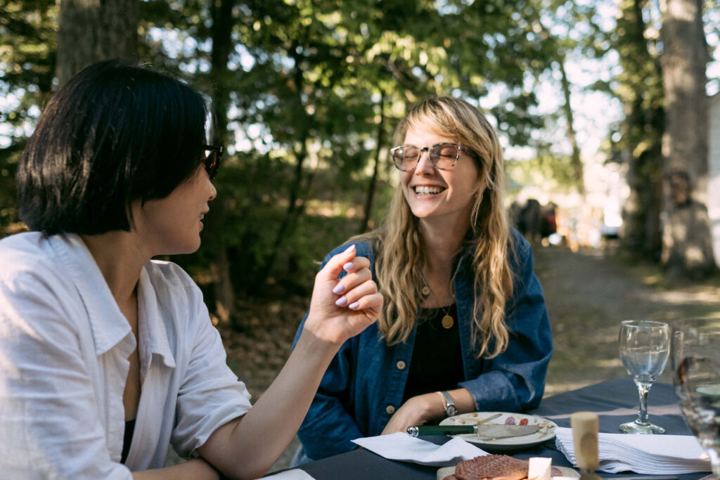 women talking and laughing